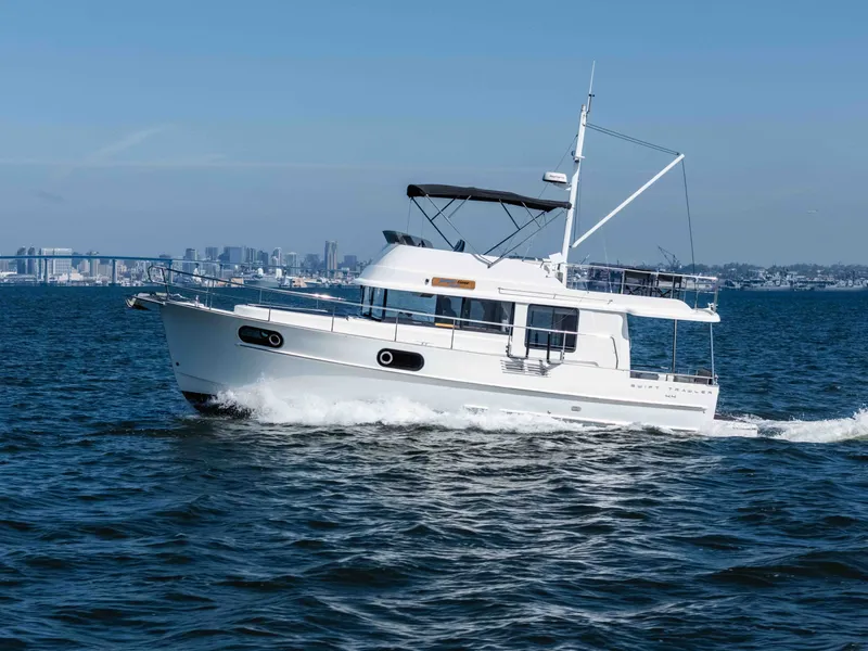 The Image of 2019 Beneteau Swift Trawler 44 cruising on open water. - 0