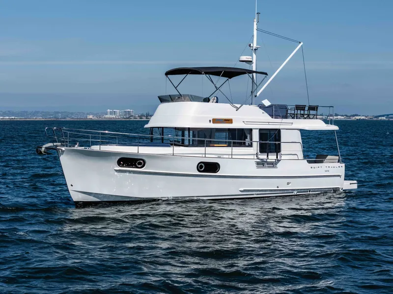 Slide: The Image of 2019 Beneteau Swift Trawler 44 on open sea. - 11