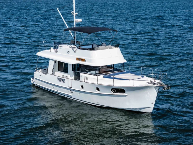 Slide: The Image of 2019 Beneteau Swift Trawler 44 cruising on open water. - 13