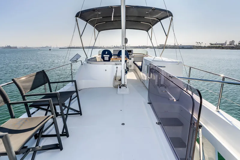 Slide: The Image of 2019 Beneteau Swift Trawler 44 on open water. - 14