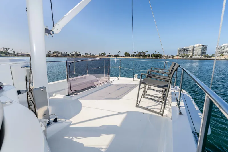 Slide: The Image of Beneteau Swift Trawler 44, 2019, on open water with coastal view. - 15