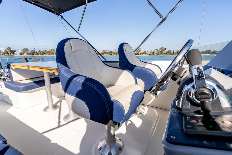 Slide: The Image of Interior of 2019 Beneteau Swift Trawler 44 with blue seating. - 18