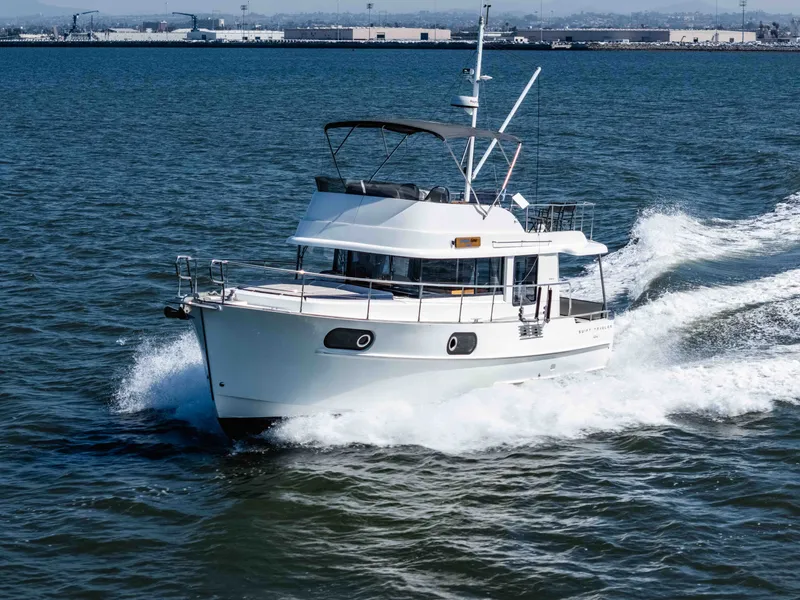 Slide: The Image of 2019 Beneteau Swift Trawler 44 cruising on open water. - 2