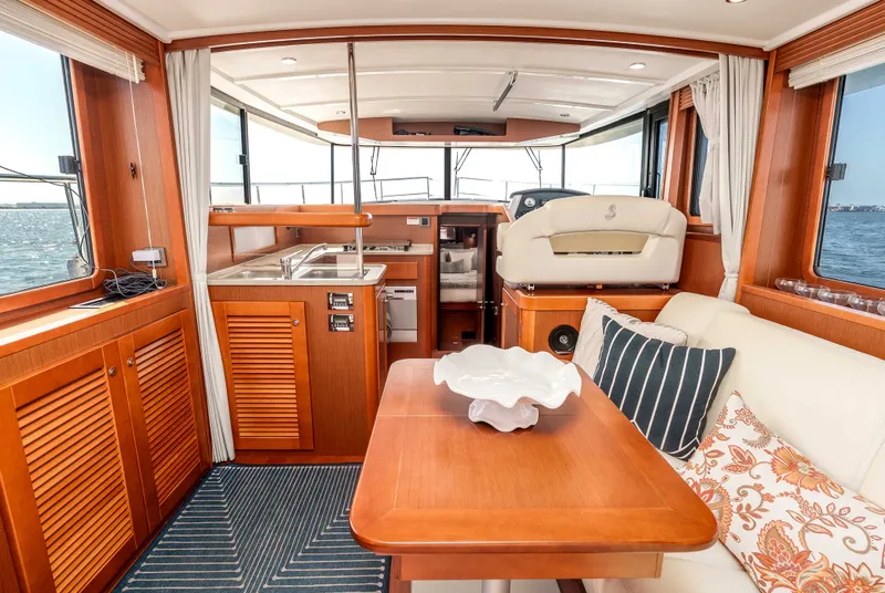 Slide: The Image of Interior of 2019 Beneteau Swift Trawler 44 with elegant wood finish. - 27