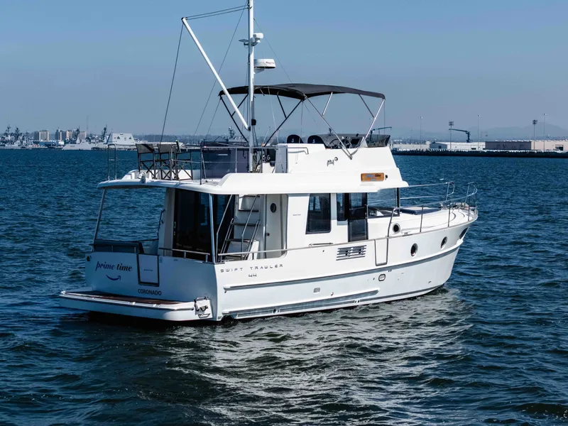 Slide: The Image of 2019 Beneteau Swift Trawler 44 on the water. - 5