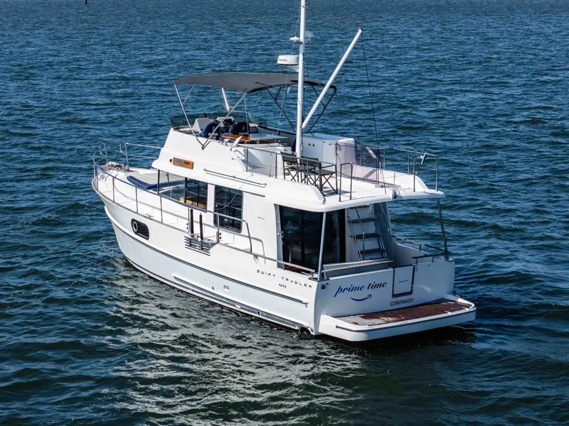 Slide: The Image of 2019 Beneteau Swift Trawler 44 on open water. - 6