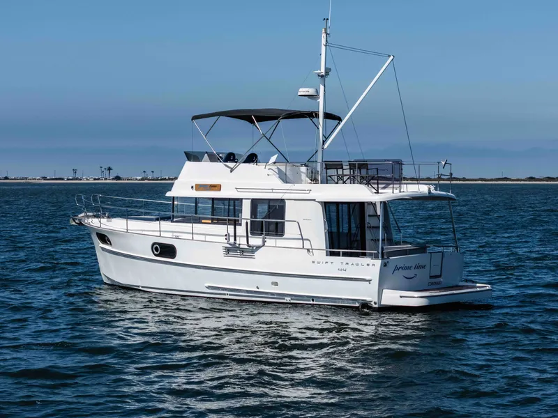 Slide: The Image of 2019 Beneteau Swift Trawler 44 on calm waters. - 9