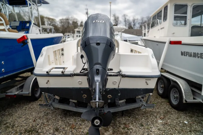 Slide: The Image of Rear view of a 2004 Mako 192 boat with outboard motor. - 3