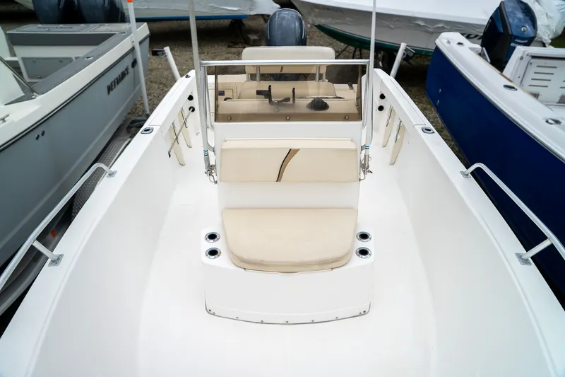 Slide: The Image of 2004 Mako 192 boat with beige seating and helm console. - 4