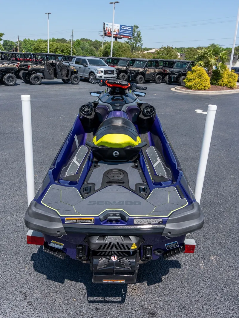 Slide: The Image of 2021 Sea-Doo RXT-X 300 IBR on parking lot, rear view. - 3