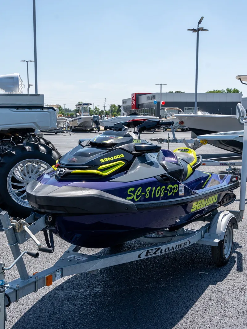 Slide: The Image of 2021 Sea-Doo RXT-X 300 IBR on trailer outdoors. - 5