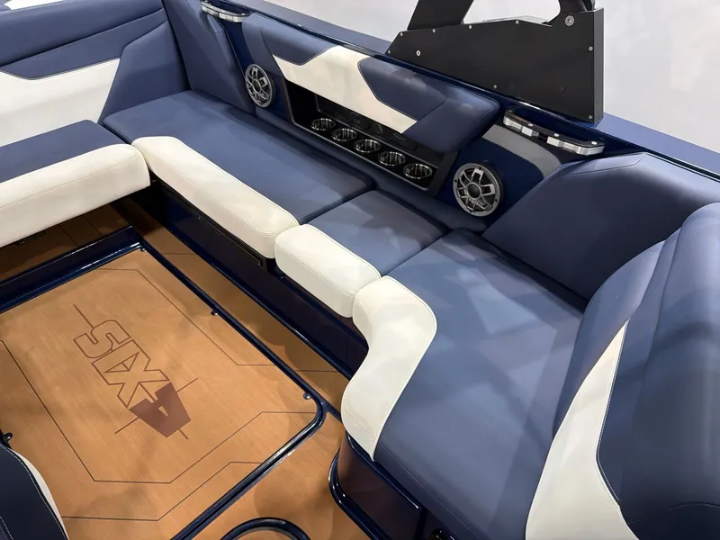 Slide: The Image of Interior of Axis A22 boat, blue-white upholstery, speakers, 2021 model. - 10