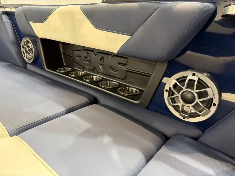 Slide: The Image of Interior of Axis A22 boat with speakers and cup holders. - 11