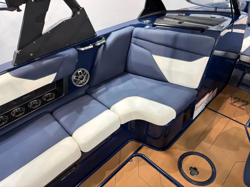Slide: The Image of Interior of Axis A22 boat, blue-white upholstery, speaker, 2021 model. - 12