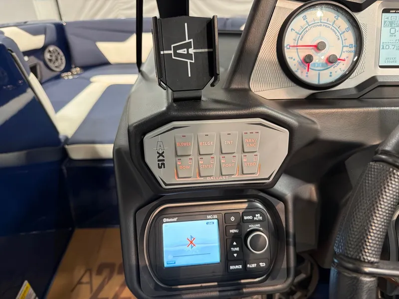 Slide: The Image of Dashboard of a 2021 Axis A22 boat with controls and gauges. - 15