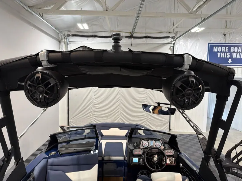 Slide: The Image of Interior view of a 2021 Axis A22 boat with speakers and control console. - 18