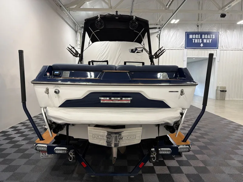 Slide: The Image of Rear view of a 2021 Axis A22 boat in a showroom. - 4