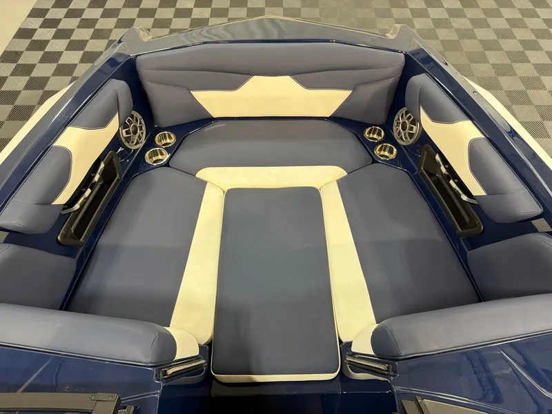 Slide: The Image of Interior of a 2021 Axis A22 boat with blue and white upholstery. - 7