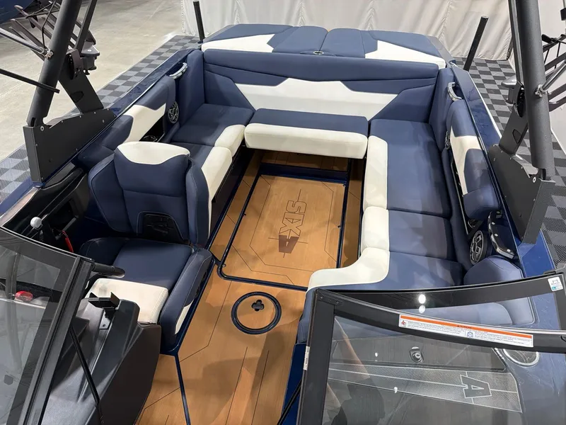 Slide: The Image of Interior of a 2021 Axis A22 boat with blue and white seating. - 8