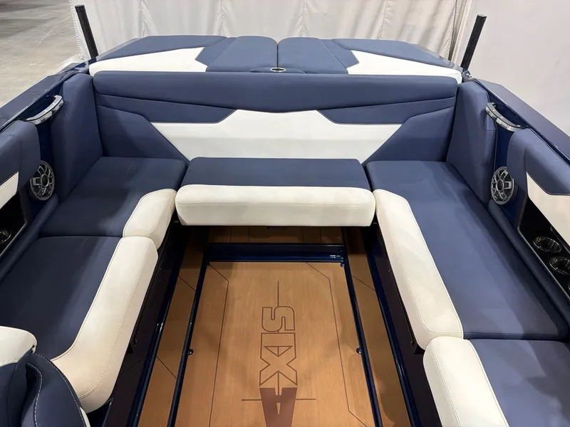 Slide: The Image of Interior of a 2021 Axis A22 boat with blue and white seating. - 9