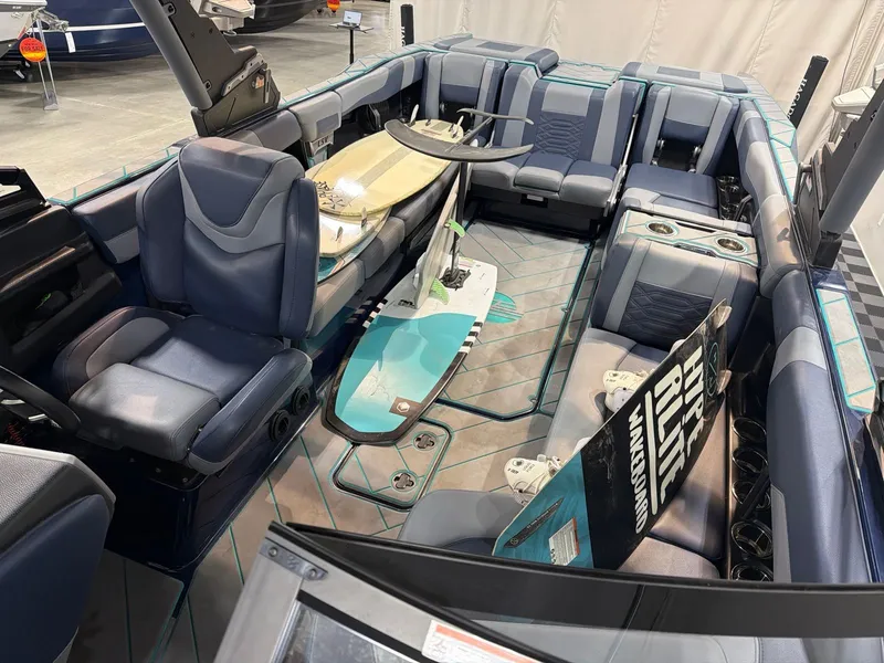 Slide: The Image of Interior of a 2023 Malibu 26 LSV with surfboards. - 10