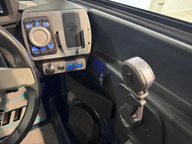Slide: The Image of Dashboard of 2023 Malibu 26 LSV with controls and switches. - 18