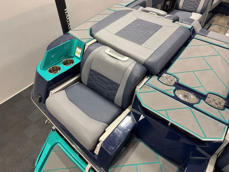 Slide: The Image of Interior of 2023 Malibu 26 LSV with luxurious seating and cup holders. - 6
