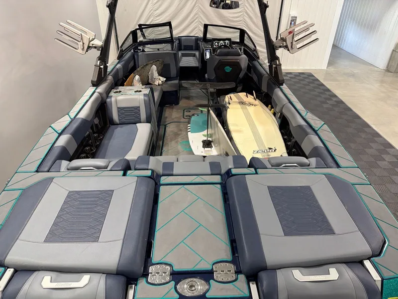 Slide: The Image of Interior of a 2023 Malibu 26 LSV boat with surfboards. - 7