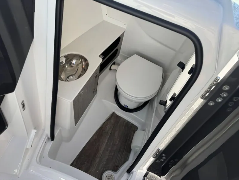 Slide: The Image of Interior of 2024 Monterey 278SS Super Sport with toilet and sink. - 8