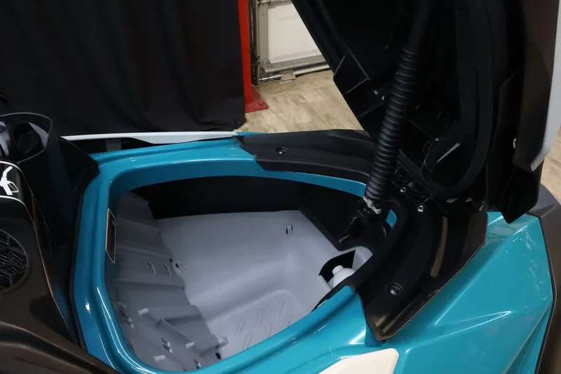 Slide: The Image of 2025 Sea-Doo GTI SE 130 storage compartment with open lid. - 12
