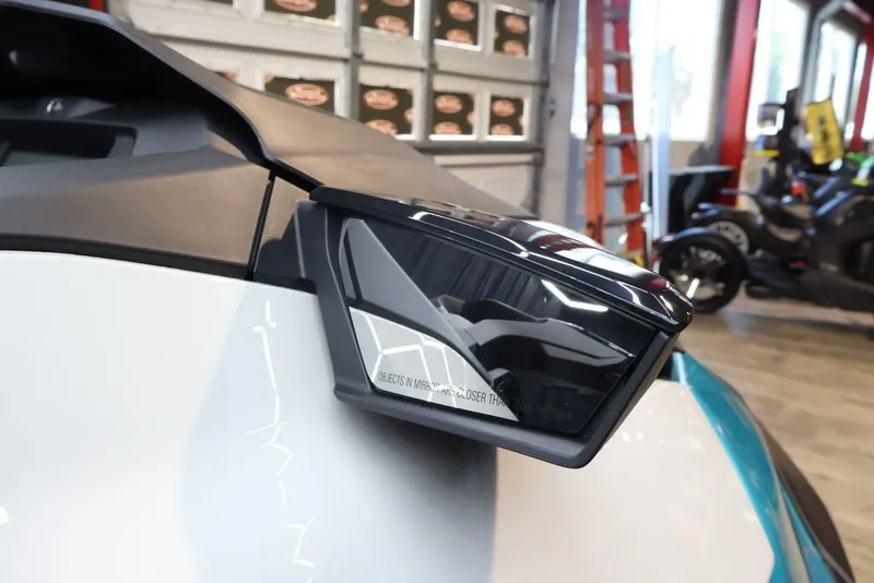 Slide: The Image of Side mirror of 2025 Sea-Doo GTI SE 130 in a garage. - 13