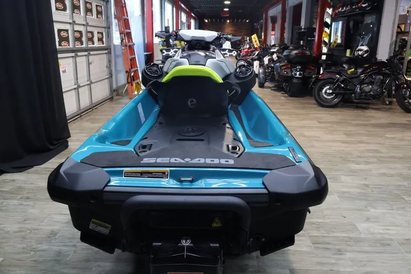 Slide: The Image of 2025 Sea-Doo GTI SE 130 jet ski in a garage. - 3