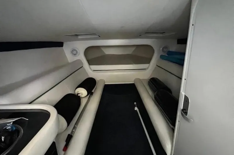 Slide: The Image of Interior cabin of a 2007 Donzi 35 ZR boat, featuring seating and storage. - 14