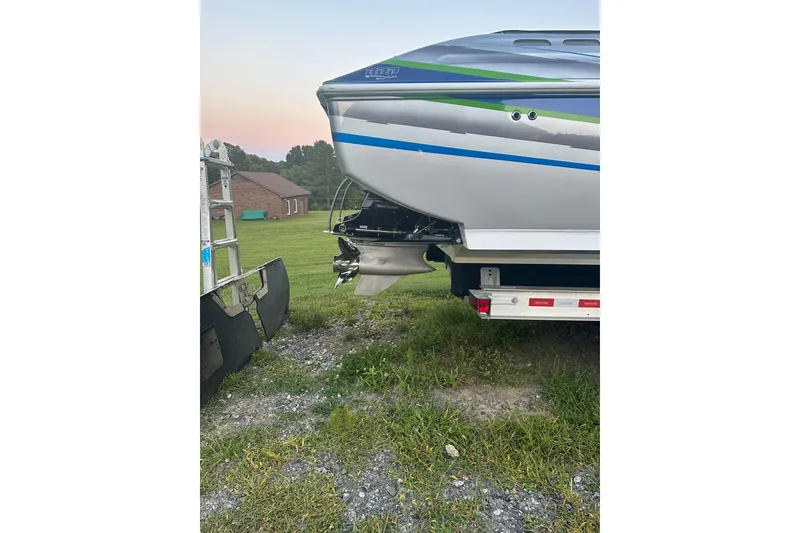 Slide: The Image of 2007 Donzi 35 ZR boat on trailer, showcasing sleek design and vibrant stripes. - 15