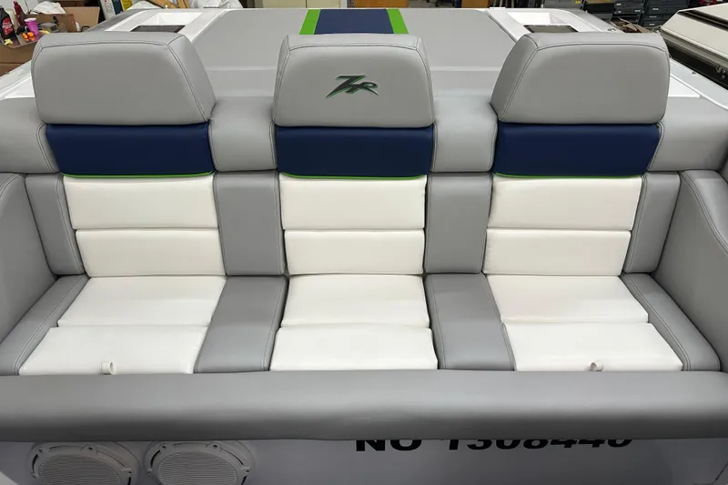 Slide: The Image of 2007 Donzi 35 ZR boat interior with gray, blue, and white seating. - 19