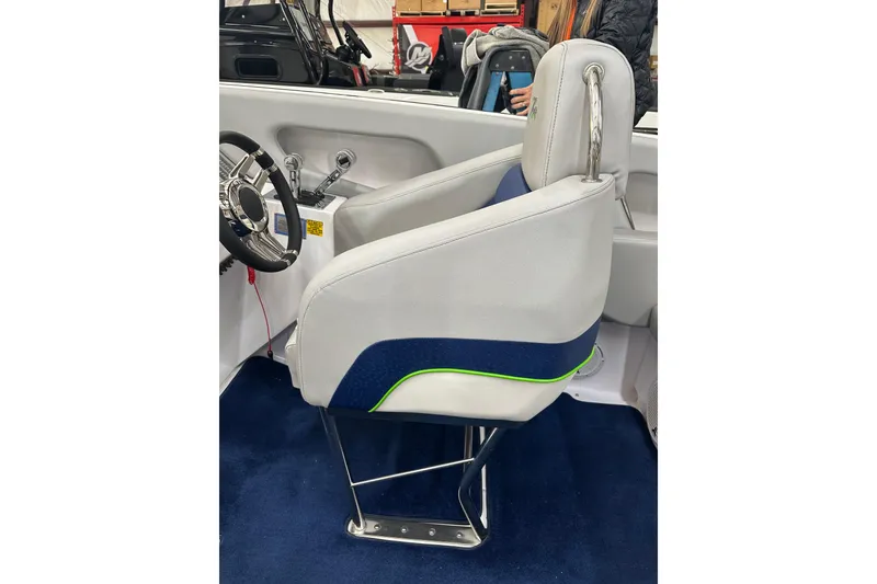 Slide: The Image of 2007 Donzi 35 ZR boat interior with white and blue seating, chrome steering wheel. - 21