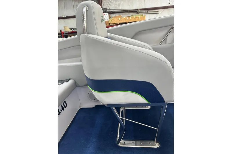 Slide: The Image of 2007 Donzi 35 ZR boat interior with sleek white and blue seating. - 22