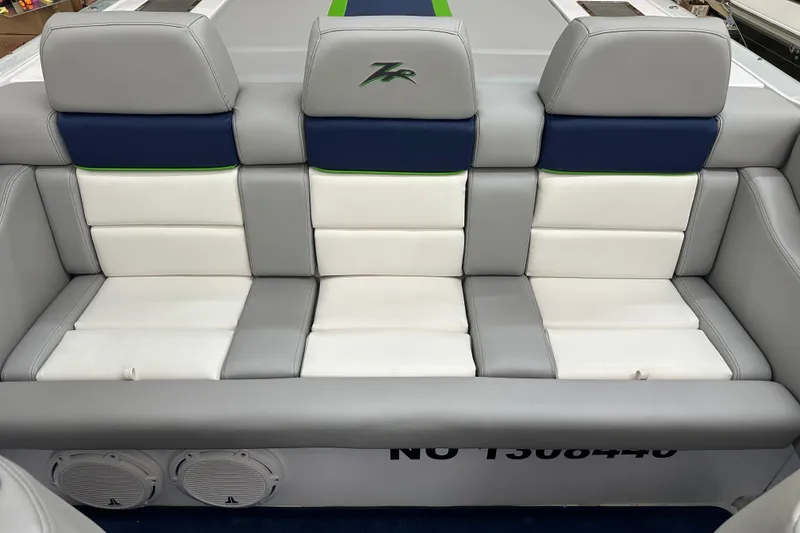 Slide: The Image of 2007 Donzi 35 ZR boat interior with gray, white, and blue seating. - 23