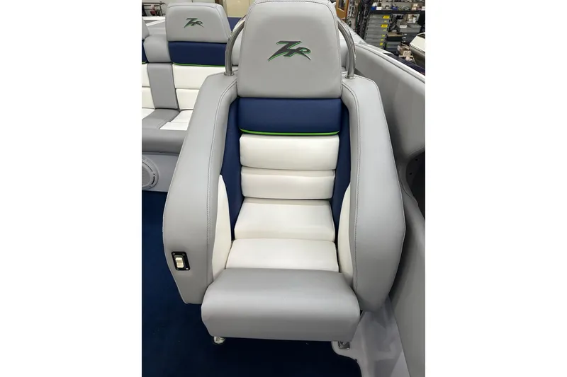 Slide: The Image of 2007 Donzi 35 ZR boat seat with blue and white upholstery, featuring the ZR logo. - 24