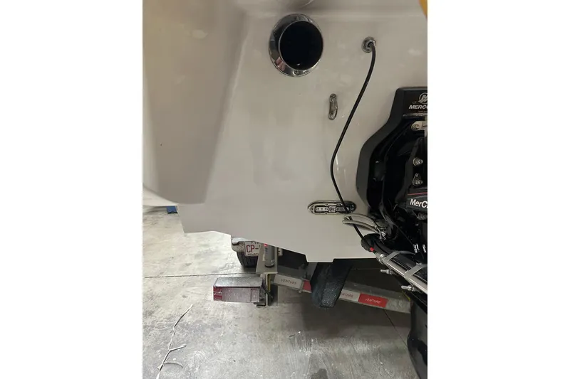 Slide: The Image of Rear view of a 2007 Donzi 35 ZR boat on a trailer in a garage. - 30