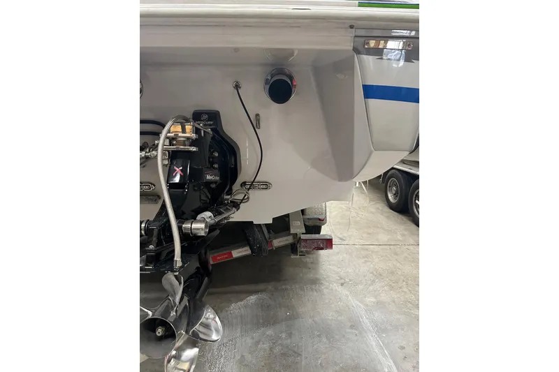 Slide: The Image of Rear view of a 2007 Donzi 35 ZR boat with visible engine components. - 31