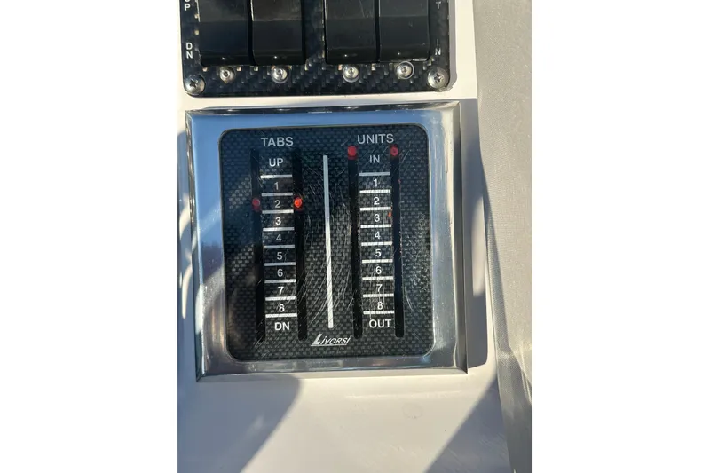 Slide: The Image of Control panel of a 2007 Donzi 35 ZR boat with Livorsi trim indicators. - 38