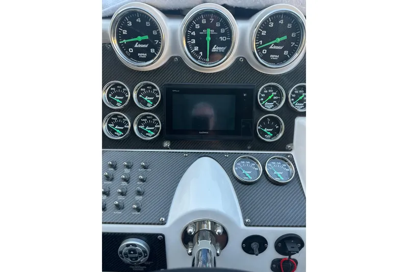 Slide: The Image of Dashboard of a 2007 Donzi 35 ZR boat with Livorsi gauges and Garmin display. - 39