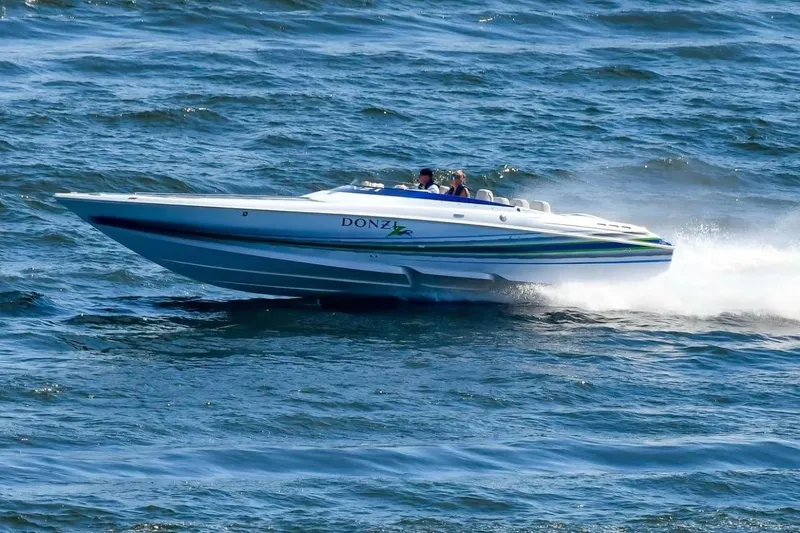 Slide: The Image of 2007 Donzi 35 ZR speedboat cruising on open water at high speed. - 4