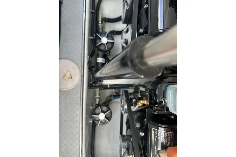 Slide: The Image of Engine components of a 2007 Donzi 35 ZR boat, featuring detailed mechanical parts. - 40