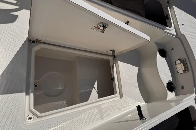 Slide: The Image of Open storage compartment on a 2015 Sailfish 320 CC boat deck. - 17