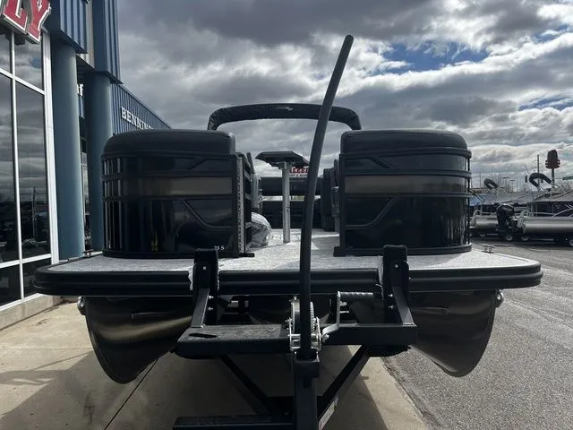 Slide: The Image of Bennington 23SSB LUXE 2026 pontoon boat on trailer under cloudy sky. - 3