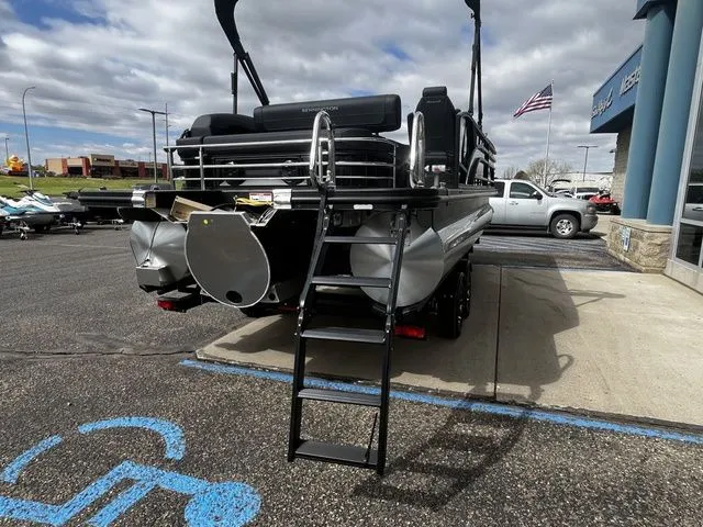 Slide: The Image of Bennington 23SSB LUXE 2026 pontoon boat on parking lot with ladder. - 6