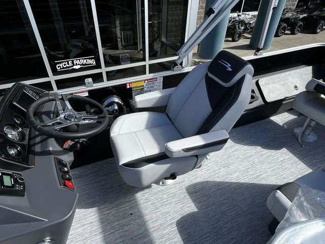Slide: The Image of Interior of 2026 Bennington 22SFC S-One with captain's chair and helm. - 14