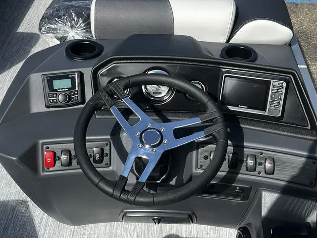 Slide: The Image of 2026 Bennington 22SFC S-One helm with steering wheel and controls. - 15